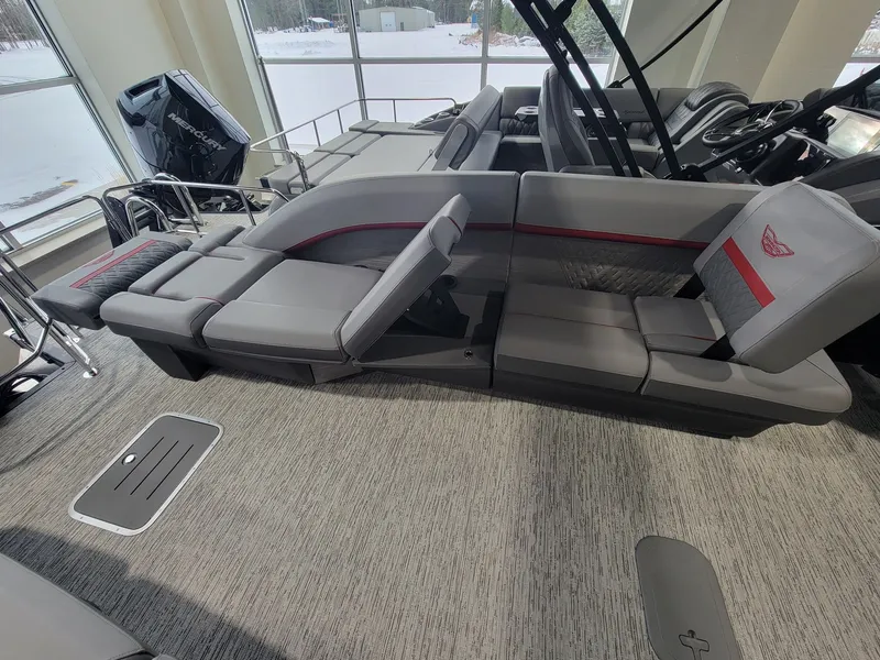 Slide: The Image of Interior of 2026 Bennington 24MSL-ESP TRI with luxurious gray seating. - 17