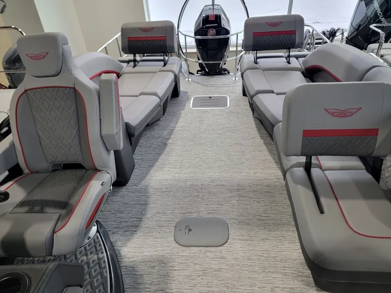 Slide: The Image of Interior of 2026 Bennington 24MSL-ESP TRI with luxurious gray seating. - 18