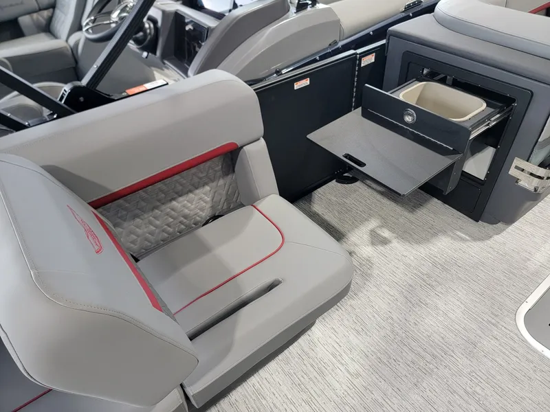 Slide: The Image of Interior of 2026 Bennington 24MSL-ESP TRI with gray seating and storage. - 20