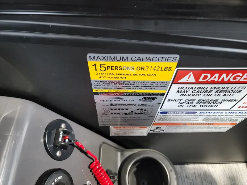 Slide: The Image of Bennington 24MSL-ESP TRI 2026 boat capacity label, 15 persons or 2142 lbs. - 21