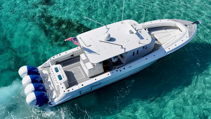 The Image of 2019 HCB 42 Siesta boat cruising on clear turquoise water. - 0