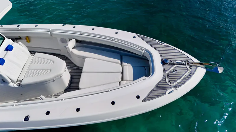Slide: The Image of 2019 HCB 42 Siesta boat with sleek design on clear blue water. - 17
