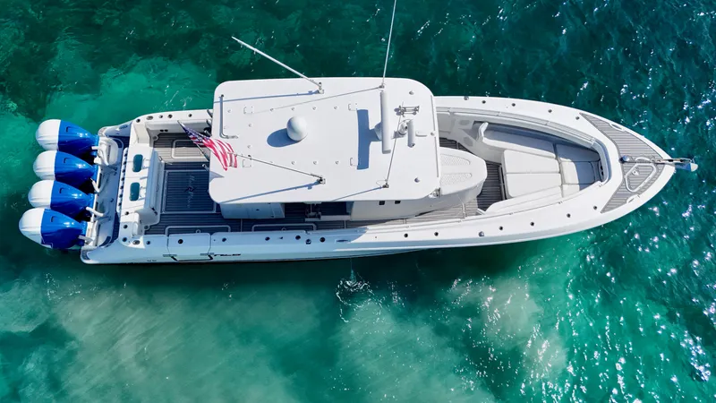 Slide: The Image of Aerial view of 2019 HCB 42 Siesta boat on clear turquoise water. - 2