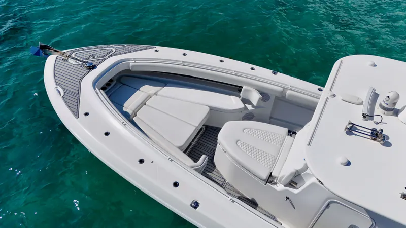 Slide: The Image of 2019 HCB 42 Siesta boat with sleek design on clear turquoise water. - 23