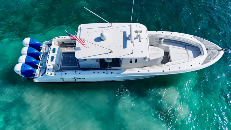 Slide: The Image of Aerial view of 2019 HCB 42 Siesta boat on clear turquoise water. - 3