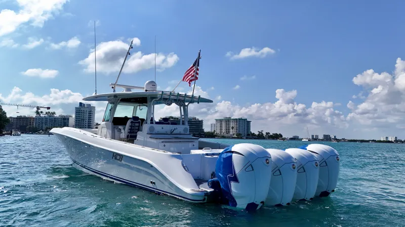 Slide: The Image of 2019 HCB 42 Siesta boat with four engines on a sunny day at sea. - 38