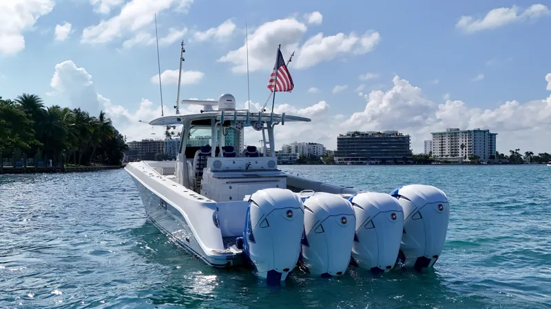 Slide: The Image of 2019 HCB 42 Siesta boat with four engines on a sunny day in coastal waters. - 41
