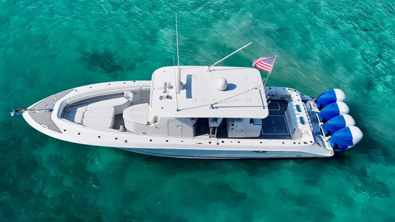 Slide: The Image of 2019 HCB 42 Siesta boat on clear turquoise water, aerial view. - 5