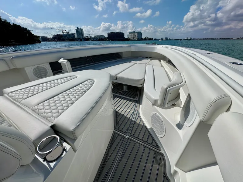 Slide: The Image of Luxurious 2019 HCB 42 Siesta boat interior with white seating and ocean view. - 52