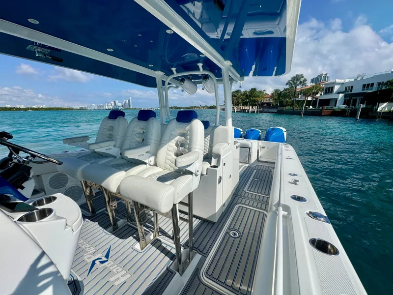 Slide: The Image of 2019 HCB 42 Siesta boat with luxurious seating on a sunny day by the water. - 70