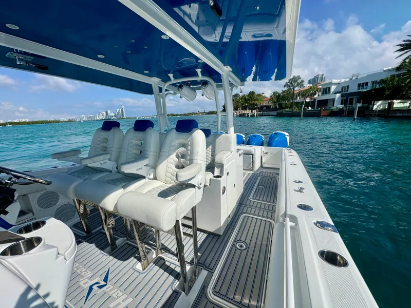 Slide: The Image of 2019 HCB 42 Siesta boat with luxurious seating, cruising on clear blue waters. - 71