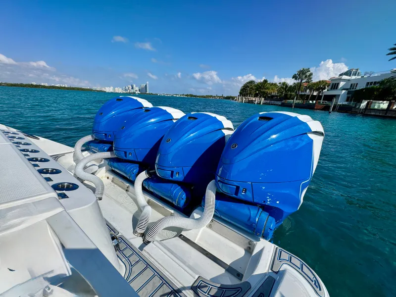 Slide: The Image of 2019 HCB 42 Siesta boat with three blue outboard engines on a sunny day. - 78