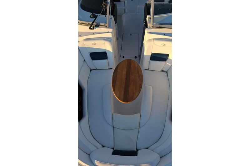 Slide: The Image of 2008 Regal 2700 ES Bowrider interior with wooden table and white seating. - 12