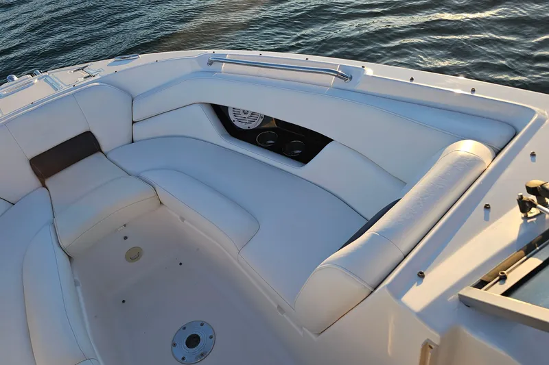 Slide: The Image of 2008 Regal 2700 ES Bowrider boat interior with white seating and cup holders. - 15