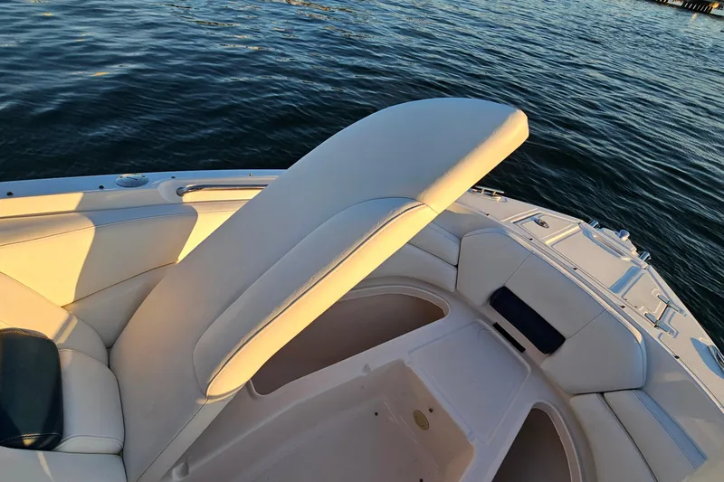 Slide: The Image of 2008 Regal 2700 ES Bowrider boat interior with cushioned seating on water. - 17