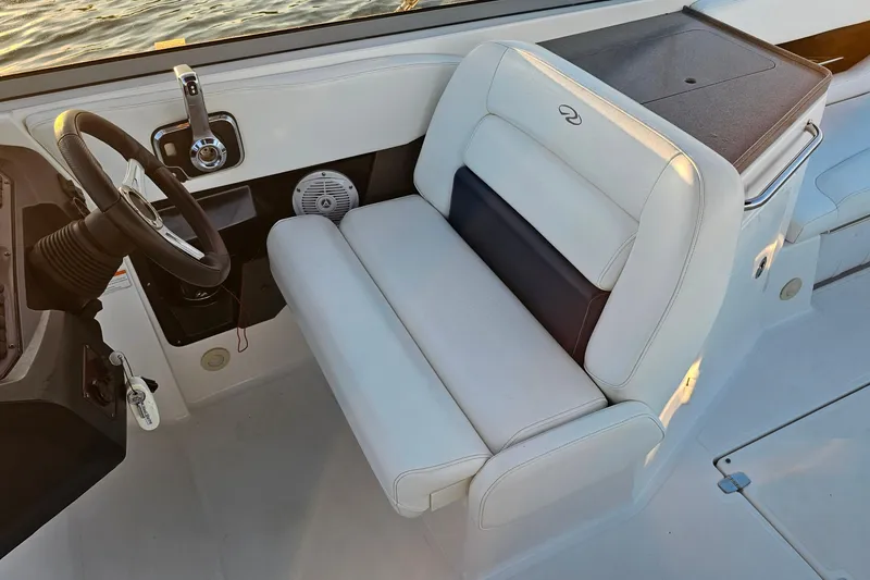 Slide: The Image of 2008 Regal 2700 ES Bowrider interior with steering wheel and white seating. - 28
