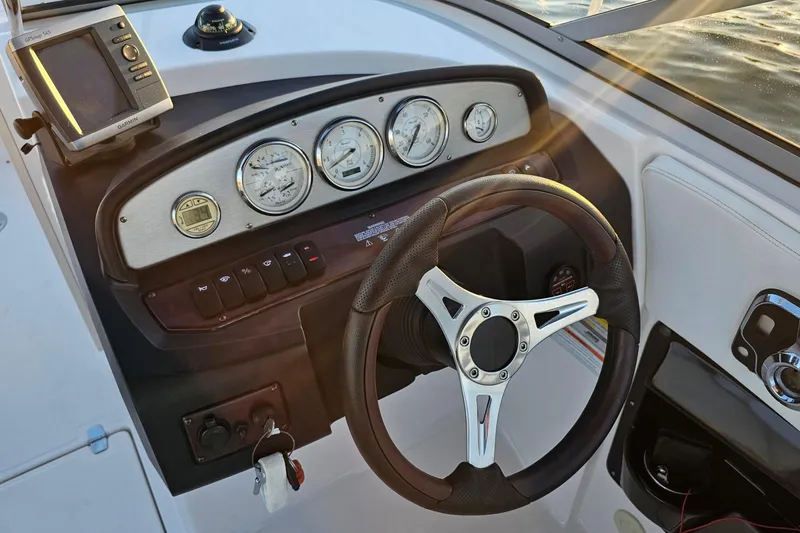 Slide: The Image of Dashboard of 2008 Regal 2700 ES Bowrider with steering wheel and gauges. - 30