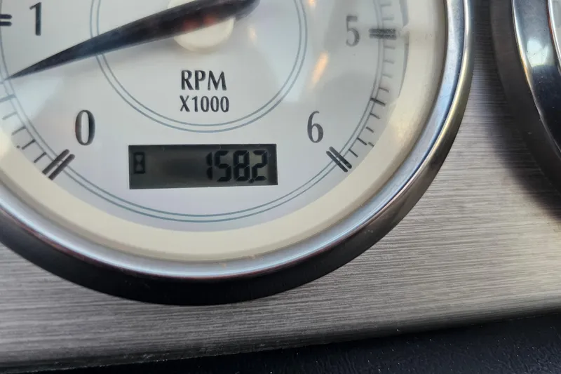 Slide: The Image of Close-up of a Regal 2700 ES Bowrider 2008 RPM gauge showing 1582 hours. - 31