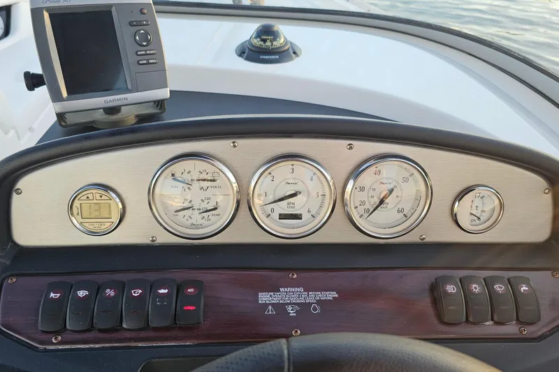 Slide: The Image of Dashboard of a 2008 Regal 2700 ES Bowrider with gauges and Garmin GPS. - 32