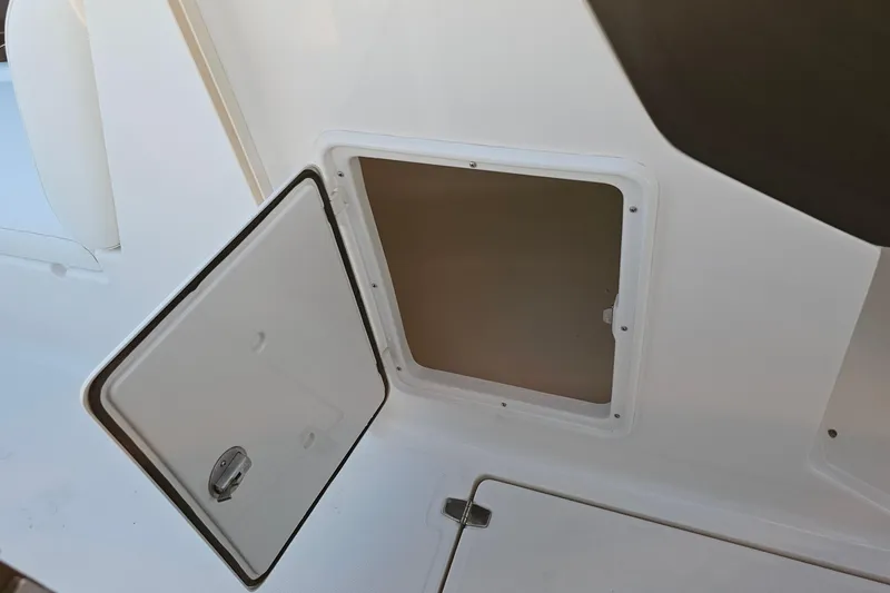 Slide: The Image of Open storage compartment on a 2008 Regal 2700 ES Bowrider boat. - 33