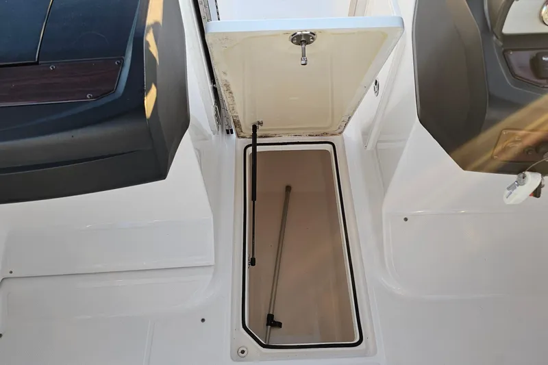 Slide: The Image of Open storage compartment on a 2008 Regal 2700 ES Bowrider boat. - 34