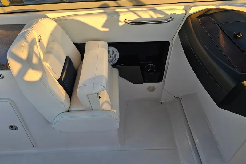Slide: The Image of 2008 Regal 2700 ES Bowrider interior with white seating and cup holder. - 36