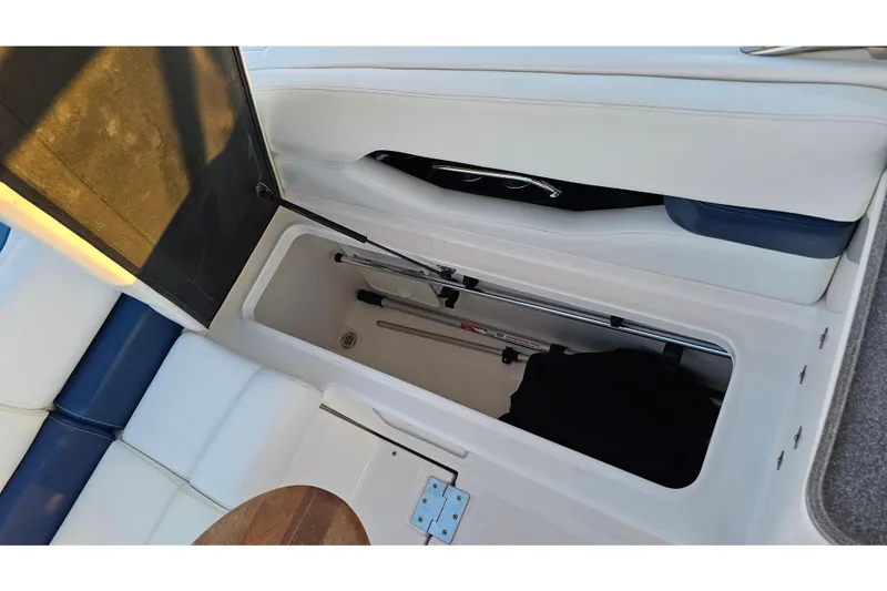 Slide: The Image of 2008 Regal 2700 ES Bowrider storage compartment with open lid and visible interior. - 43