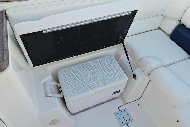 Slide: The Image of 2008 Regal 2700 ES Bowrider interior with white seating and Igloo cooler. - 46