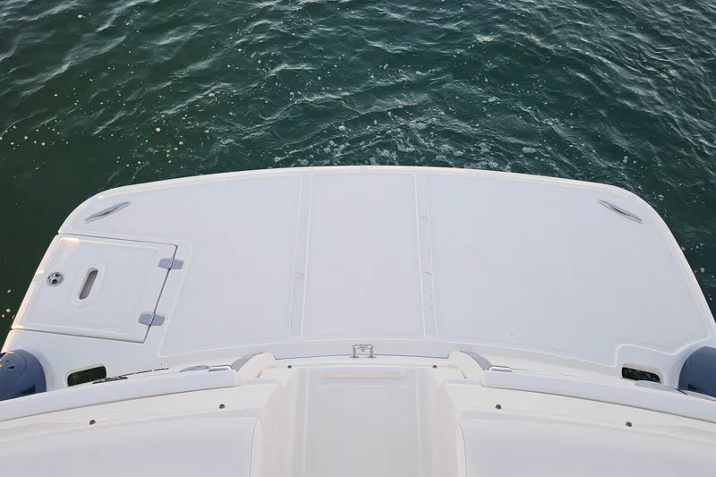Slide: The Image of 2008 Regal 2700 ES Bowrider boat deck overlooking calm water. - 47