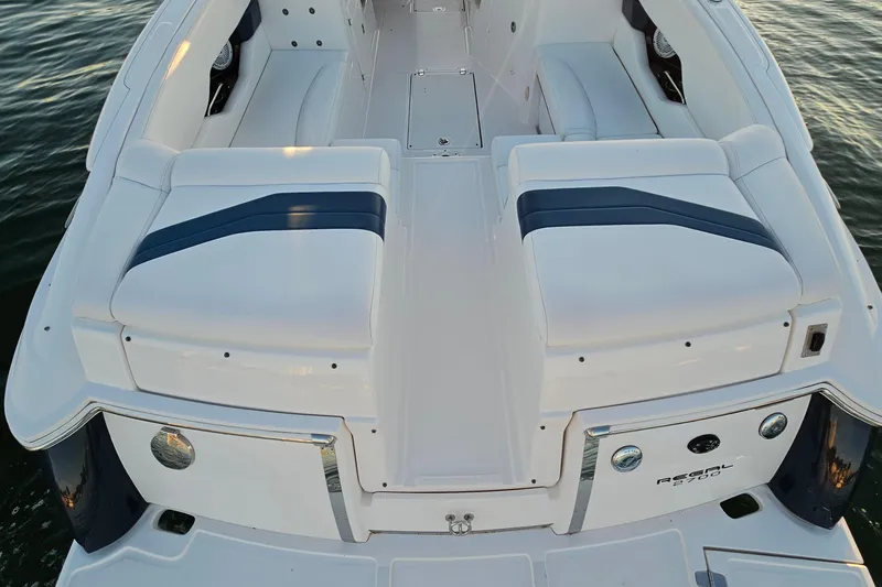 Slide: The Image of 2008 Regal 2700 ES Bowrider boat with white seating and sleek design on water. - 48