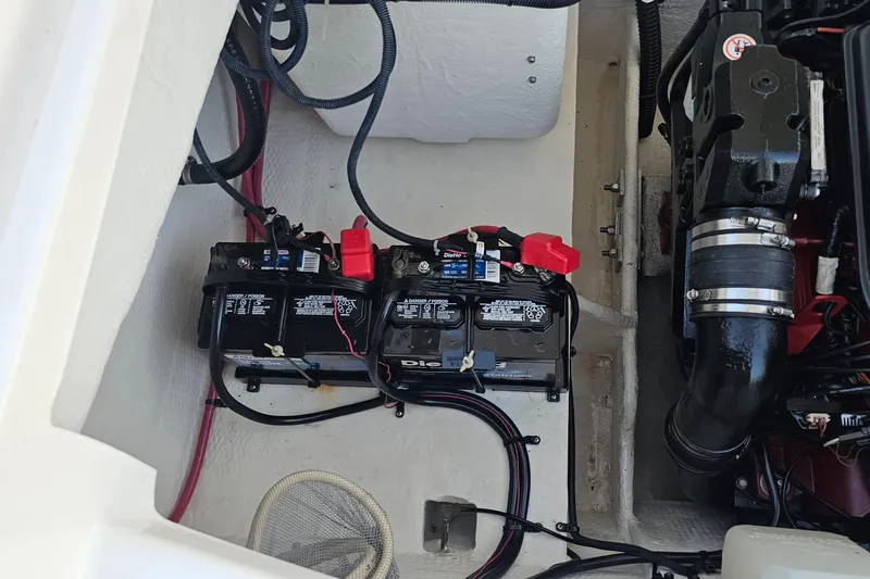 Slide: The Image of 2008 Regal 2700 ES Bowrider engine compartment with dual batteries and wiring. - 52