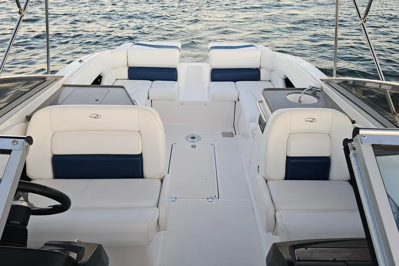 Slide: The Image of 2008 Regal 2700 ES Bowrider interior with white and blue seating on water. - 56