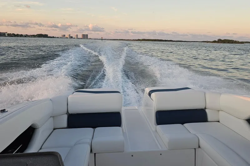 Slide: The Image of 2008 Regal 2700 ES Bowrider cruising on open water at sunset. - 57