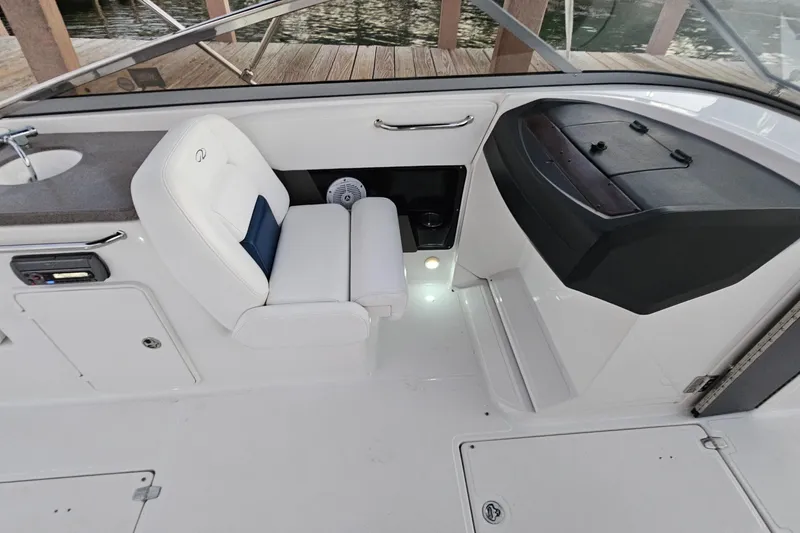 Slide: The Image of 2008 Regal 2700 ES Bowrider interior with white seating and dashboard details. - 61