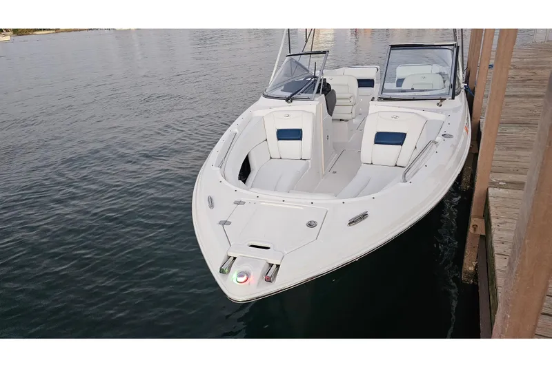 Slide: The Image of 2008 Regal 2700 ES Bowrider docked, showcasing sleek design and spacious seating. - 65