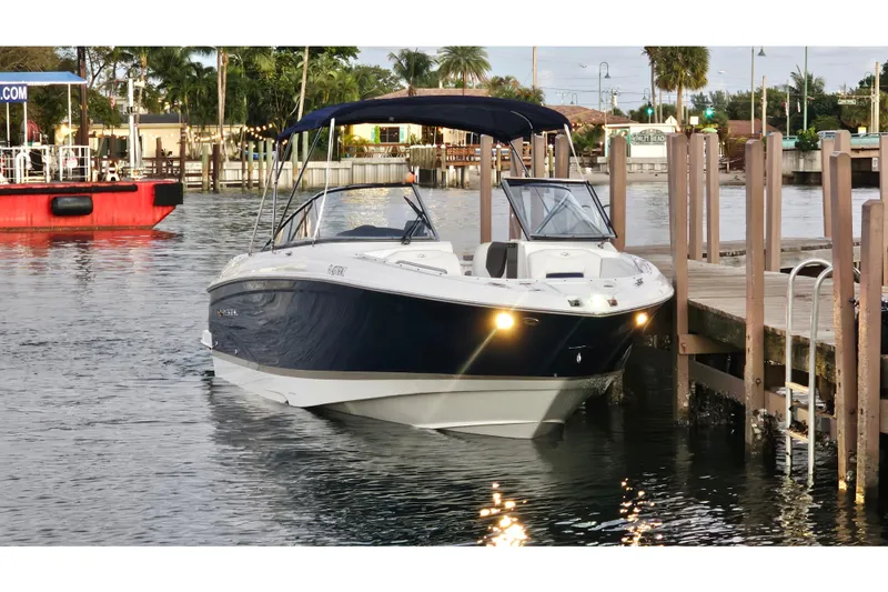 Slide: The Image of 2008 Regal 2700 ES Bowrider docked at a marina, surrounded by calm waters. - 67