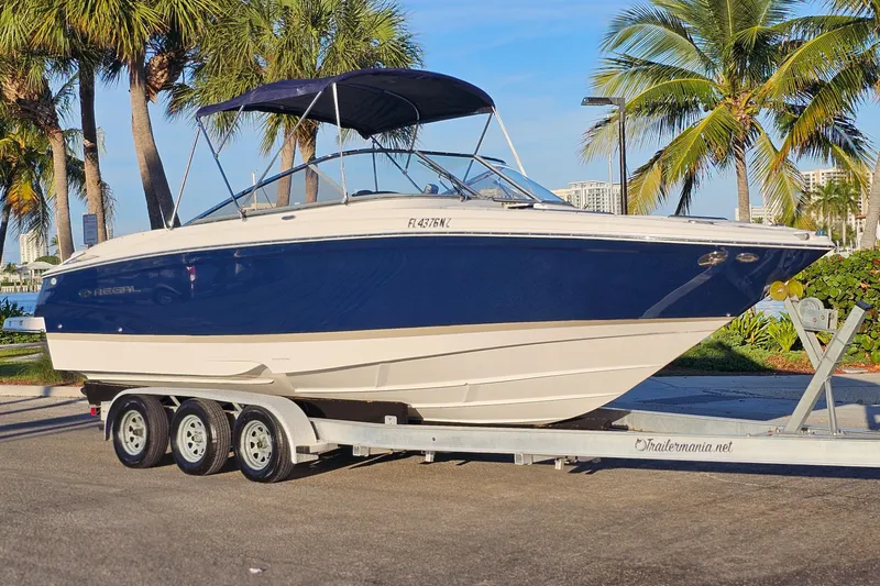 Slide: The Image of 2008 Regal 2700 ES Bowrider on trailer, parked near palm trees. - 7
