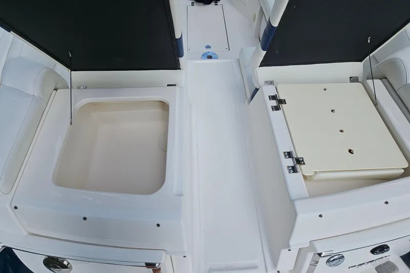 Slide: The Image of 2008 Regal 2700 ES Bowrider storage compartments, open view, showcasing interior space. - 70