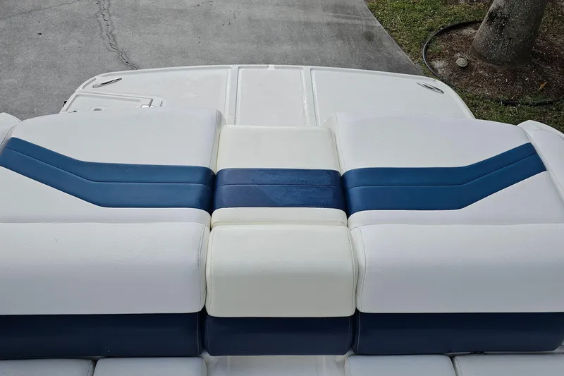 Slide: The Image of 2008 Regal 2700 ES Bowrider boat seating with blue and white upholstery. - 71