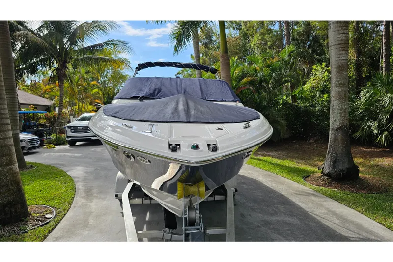 Slide: The Image of 2008 Regal 2700 ES Bowrider on trailer, surrounded by tropical trees. - 75