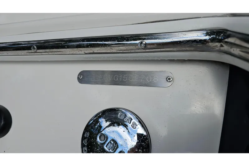 Slide: The Image of 2008 Regal 2700 ES Bowrider boat identification plate and gas cap detail. - 82