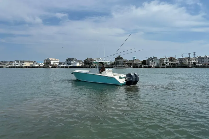Slide: The Image of 2010 Jupiter 34 FS boat on calm water near coastal homes. - 13