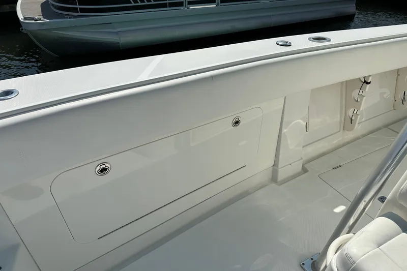 Slide: The Image of 2010 Jupiter 34 FS boat interior with storage compartments and seating. - 30