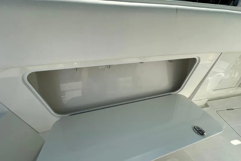Slide: The Image of 2010 Jupiter 34 FS boat storage compartment with open lid. - 31
