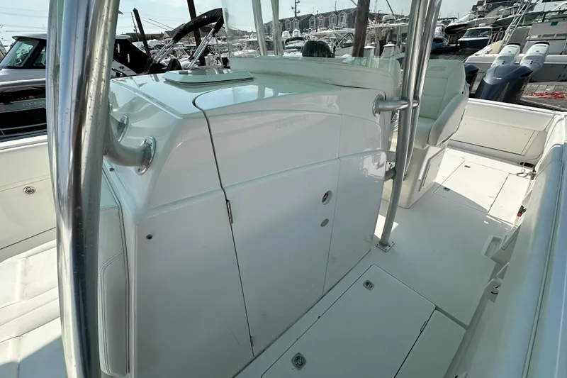 Slide: The Image of 2010 Jupiter 34 FS boat interior with sleek white design and stainless steel accents. - 34