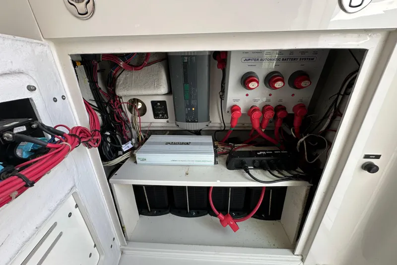 Slide: The Image of Electrical system of a 2010 Jupiter 34 FS boat, featuring battery controls and wiring. - 40