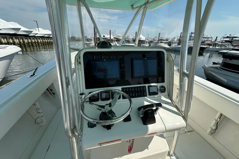 Slide: The Image of 2010 Jupiter 34 FS boat helm with dual screens at marina. - 43
