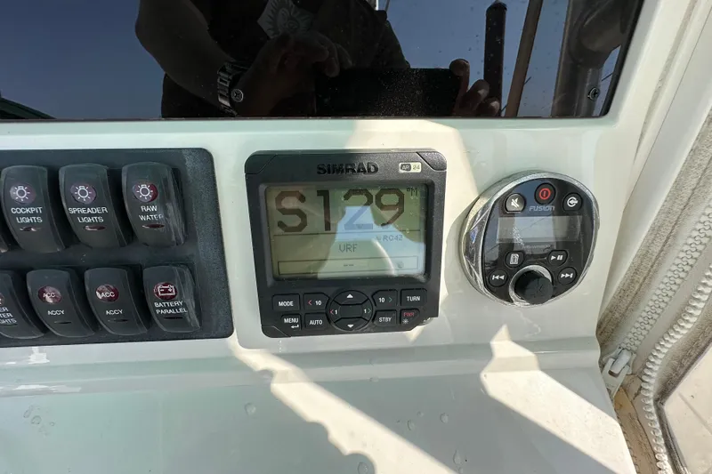 Slide: The Image of Control panel of a 2010 Jupiter 34 FS boat with Simrad and Fusion systems. - 46