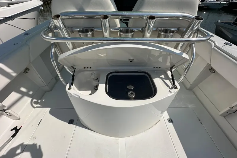Slide: The Image of 2010 Jupiter 34 FS boat with open storage compartment and rod holders. - 54