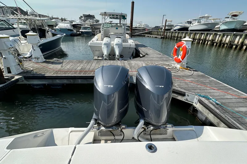 Slide: The Image of 2010 Jupiter 34 FS boat docked with twin V8 engines in a marina. - 57
